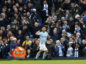 Manchester City's Sergio Aguero celebrates scoring his side's first goal of the game, during the English Premier League soccer match between Manchester City and Bournemouth, at the Etihad Stadium, in Manchester, England, Saturday, Dec. 23, 2017.