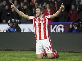 Stoke City's Ramadan Sobhi celebrates scoring his side's first goal of the game during their English Premier League soccer match against Huddersfield at the John Smith's Stadium, Huddersfield, England, Tuesday, Dec. 26, 2017.