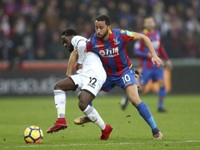 Swansea City's Nathan Dyer, left, and Crystal Palace's Andros Townsend battle for the ball during the English Premier League soccer match at the Liberty Stadium, Swansea, England, Saturday, Dec. 23, 2017.