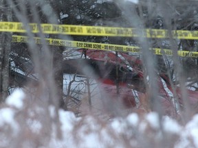 The crash Hydro One helicopter can be seen at the crash site near Tweed, Ont., on Dec. 14, 2017. Four Hydro One employees were killed Thursday in a helicopter crash in eastern Ontario, police and the utility reported.The crash occurred about noon in Tweed, north of Kingston, provincial police said.