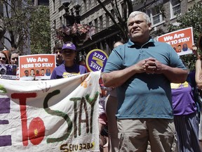 File- In this July 6, 2017 file photo, MIT janitor Francisco Rodriguez listens to speakers during a "Here to Stay" rally at the Irish Famine Memorial in Boston. Rodriguez, who was facing deportation to El Salvador, has been released from a Boston jail. Francisco Rodriguez-Guardado was released by U.S. Immigration and Customs Enforcement on Thursday. Dec. 21, 2017, after being held since July at the Suffolk County House of Corrections. His lawyers say his removal proceedings have been stayed pending their request to reopen his asylum case. Rodriguez-Guardado's mother says the family is "overjoyed."