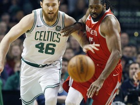 Boston Celtics' Aron Baynes (46) and Houston Rockets' Nene chase the ball during the first quarter of an NBA basketball game in Boston, Thursday, Dec. 28, 2017.
