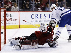 Toronto Maple Leafs center Patrick Marleau, right, scores a goal against Arizona Coyotes goalie Scott Wedgewood during the second period Thursday in Glendale, Ariz.