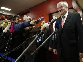 Bavarian governor and chairman of the Christian Social party, CSU, Horst Seehofer, arrives for a fraction meeting in Munich, Germany, Monday, Dec. 4, 2017.