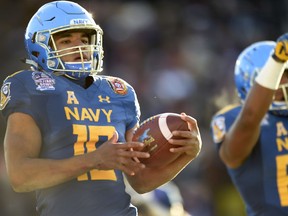 Navy's quarterback Malcolm Perry scores a touchdown against Virginia in the first half of the Military Bowl NCAA college football game, Thursday, Dec. 28, 2017, in Annapolis, Md.