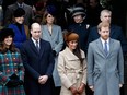 Catherine, Duchess of Cambridge, Prince William, Duke of Cambridge, Meghan Markle and Prince Harry wait to see off Britain's Queen Elizabeth II after attending the Royal Family's traditional Christmas Day church service in Sandringham, Norfolk, eastern England, on Dec. 25, 2017.