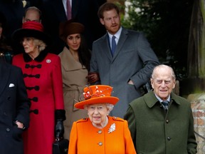 Queen Elizabeth and Prince Philip, Duke of Edinburgh leave after attending the Royal Family's traditional Christmas Day church service at St Mary Magdalene Church in Sandringham, Norfolk, eastern England, on Dec. 25, 2017.