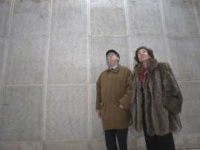 In this photo taken on Tuesday, Dec. 5, 2017 French Nazi hunters Serge Klarsfeld, left, and his wife Beate look at the Wall of Names at the Shoah Memorial in Paris. The story of Nazi hunters Beate and Serge Klarsfeld is well known in many ways _ and has even spawned a Hollywood movie. Yet, not all has been told of the steely married couple's quest to bring down some of the Third Reich's most infamous villains including Klaus Barbie, the so-called "Butcher of Lyon." Paris' Shoah Memorial is this week hosting the world's first ever exhibit into their story _ called "Beate and Serge Klarsfeld, Fighters for Memory."
