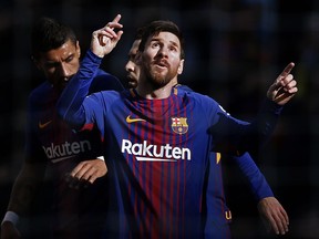 FC Barcelona's Lionel Messi celebrates after scoring during a Spanish La Liga soccer match between FC Barcelona and Celta Vigo at the Camp Nou stadium in Barcelona, Saturday, Dec. 2, 2017.
