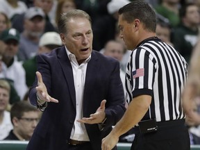 Michigan State head coach Tom Izzo, left, argues a call during the first half of an NCAA college basketball game against Houston Baptist, Monday, Dec. 18,2017, in East Lansing, Mich.