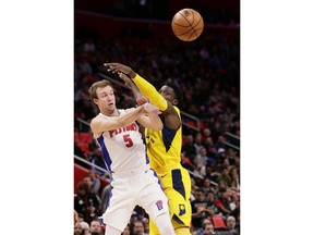 Detroit Pistons guard Luke Kennard (5) passes the ball against Indiana Pacers guard Victor Oladipo during the first half of an NBA basketball game, Tuesday, Dec. 26, 2017, in Detroit.