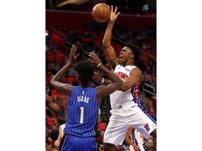 Detroit Pistons forward Stanley Johnson (7) drives against Orlando Magic forward Jonathan Isaac (1) in the first half of an NBA basketball game in Detroit, Sunday, Dec. 17, 2017.