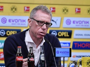 Austrian coach Peter Stoeger talks to the media at a press conference of Borussia Dortmund, where he is presented as the new head coach of the Bundesliga soccer club in Dortmund, Germany, Sunday, Dec. 10, 2017. Borussia Dortmund displaced Dutch head coach Peter Bosz Saturday after a defeat against Werder Bremen. Stoeger was dismissed as head coach of FC Cologne earlier this month.
