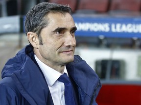 Barcelona coach Ernesto Valverde watches prior the Champions League Group D soccer match between FC Barcelona and Sporting CP at the Camp Nou stadium in Barcelona, Spain, Tuesday, Dec. 5, 2017.