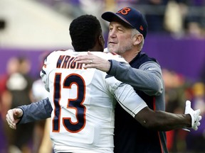 Chicago Bears head coach John Fox hugs wide receiver Kendall Wright (13) before an NFL football game against the Minnesota Vikings, Sunday, Dec. 31, 2017, in Minneapolis.