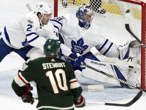 Minnesota Wild left wing Tyler Ennis, not pictured, scores a goal past Toronto Maple Leafs defenseman Ron Hainsey (2) and goalie Frederik Andersen (31), of Denmark, as Minnesota Wild right wing Chris Stewart (10) watches during the first period of an NHL hockey game Thursday, Dec. 14, 2017, in St. Paul, Minn.