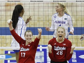 Nebraska outside hitter Annika Albrecht (17) and middle blocker Lauren Stivrins (26) celebrate a point against Florida during an NCAA Division I volleyball championship game Saturday, Dec. 16, 2017, in Kansas City, Mo. Florida middle blocker Rhamat Alhassan, back left, and Florida outside hitter Carli Snyder, right, react.