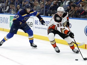 Anaheim Ducks' Jakob Silfverberg, of Sweden, controls the puck as St. Louis Blues' Jordan Schmaltz (43) defends during the first period of an NHL hockey game Thursday, Dec. 14, 2017, in St. Louis.