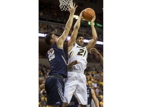 Missouri's Jordan Barnett, right, pulls down a rebound in front of North Florida's Trip Day, left, during the first half of an NCAA college basketball game Saturday, Dec. 16, 2017, in Columbia, Mo.