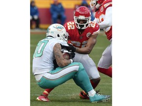 Kansas City Chiefs defensive back Marcus Peters (22) tackles and strips the ball away from Miami Dolphins wide receiver Kenny Stills (10) for a turnover during the second half of an NFL football game in Kansas City, Mo., Sunday, Dec. 24, 2017.