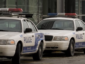 A line of Montreal Police cruisers.