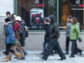 Pedestrians walk on McGill College Ave. in Montreal Wednesday February 8, 2012.