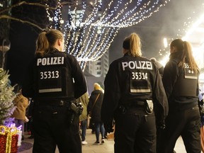 Police patrol at the Christmas market at Breitscheidplatz square in Berlin, Monday Dec. 18, 2017 where a truck steered by Tunisian attacker Anis Amri ran into a crowded Christmas market and killed several people a year ago on Dec. 19, 2016.