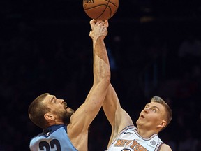 Memphis Grizzlies' Marc Gasol (33) competes for the ball with New York Knicks' Kristaps Porzingis (6) during the first half of an NBA basketball game at Madison Square Garden in New York, Wednesday, Dec. 6, 2017.