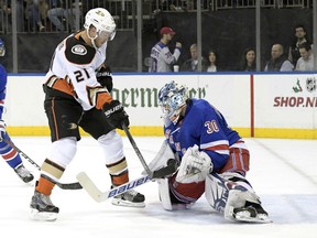 New York Rangers goalie Henrik Lundqvist (30) makes a save on a shot by Anaheim Ducks center Chris Wagner (21) during the first period of an NHL hockey game, Tuesday, Dec.19, 2017, at Madison Square Garden in New York.
