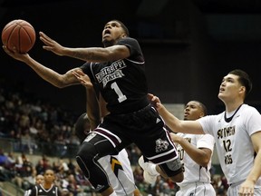 Mississippi State guard Lamar Peters (1) attempts a layup past Southern Mississippi forward Tim Rowe (12) in the first half of an NCAA college basketball game in Jackson, Miss., Saturday, Dec. 23, 2017.