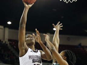 Mississippi State center Teaira McCowan (15) shoots overMississippi Valley State's Kenya Arnold for a basket during the first half of an NCAA college basketball game in Starkville, Miss., Thursday, Dec. 28, 2017.