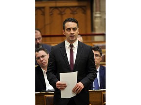 In this Monday, Dec. 11, 2017 photo leader of the oppositional Jobbik party Gabor Vona speaks during a plenary session of the Hungarian Parliament in Budapest, Hungary. Vona said there is no way back to its far-right identity, including frequent anti-Semitic and racist remarks by its politicians. He told The Associated Press that his priorities in government would be to get rid of corruption and restore democratic checks and balances.