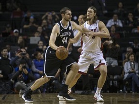Brooklyn Nets' Tyler Zeller, left, drives with the ball as Miami Heat's Kelly Olynyk defends during the first quarter of an NBA basketball game in Mexico City, Saturday, Dec. 9, 2017.
