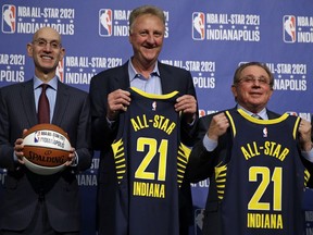 NBA Commissioner Adam Silver, left, is joined by Indiana Pacers owner Herb Simon, right, and Larry Bird, after he announced in Indianapolis, Wednesday, Dec. 13, 2017 that Indianapolis will host the 2021 NBA All-Star game .