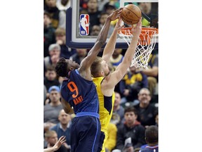 Oklahoma City Thunder forward Jerami Grant (9) comes from behind to block the shot of Indiana Pacers center Domantas Sabonis (11) during the first half of an NBA basketball game in Indianapolis, Wednesday, Dec. 13, 2017.