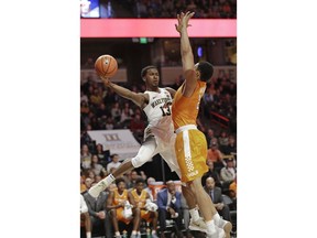 Wake Forest's Bryant Crawford (13) drives against Tennessee's Grant Williams (2) during the first half of an NCAA college basketball in Winston-Salem, N.C., Saturday, Dec. 23, 2017.