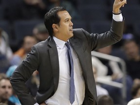 Miami Heat head coach Erik Spoelstra directs his team against the Charlotte Hornets during the first half of an NBA basketball game in Charlotte, N.C., Friday, Dec. 15, 2017.