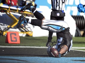 Carolina Panthers' Jonathan Stewart (28) falls into the end zone for a touchdown against the Minnesota Vikings during the first half of an NFL football game in Charlotte, N.C., Sunday, Dec. 10, 2017.