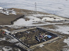 FILE - This Feb. 13, 2017, aerial file photo shows a site where the final phase of the Dakota Access Pipeline near the Missouri River took place with boring equipment routing the pipeline underground and across Lake Oahe to connect with the existing pipeline in Emmons County in Cannon Ball, N.D. A federal judge on Monday, Dec. 4, 2017, ordered the Army Corps of Engineers and pipeline developer Energy TransFer Partners to complete an oil spill response plan for a section of the pipeline beneath the Missouri River in North Dakota.