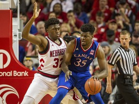 Kansas center Udoka Azubuike (35) bumps into Nebraska center Jordy Tshimanga (32) to make a basket during the first half of an NCAA college basketball game in Lincoln, Neb., Saturday, Dec. 16, 2017.