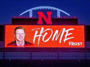 The Memorial Stadium video board displays a "Welcome Home" message to new Nebraska football coach Scott Frost on Saturday, Dec. 2, 2017, in Lincoln, Neb. Frost, the native son who quarterbacked Nebraska to a share of the national championship 20 years ago, is returning to the Cornhuskers as coach after orchestrating a stunning two-year turnaround at Central Florida.