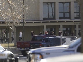 Students are led out of Aztec High School after a shooting Thursday, Dec. 7, 2017, in Aztec, N.M. The school is in the Four Corners region and is near the Navajo Nation. (Jon Austria /The Daily Times via AP) ORG XMIT: NMFAR501