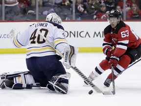 Buffalo Sabres goaltender Robin Lehner (40), of Sweden, defends his net as New Jersey Devils left wing Jesper Bratt (63), of Sweden, attacks during the second period of an NHL hockey game, Friday, Dec. 29, 2017, in Newark, N.J.