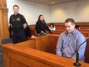 Brandon Phillips sits the in Supreme Court of Newfoundland and Labrador in St. John's on Thursday Dec. 1, 2016. The premier of Newfoundland and Labrador will be in court today asking a judge to block media from reporting on documents linked to a St. John's murder case. THE CANADIAN PRESS/Sue Bailey ORG XMIT: CPT502