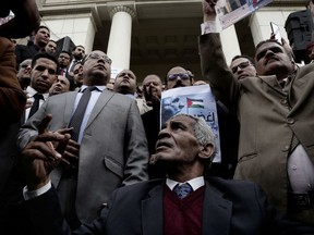 Lawyers chant slogans during a protest after a recent U.S. decision to recognize Jerusalem as the capital of Israel, outside the Lawyers Syndicate in Cairo, Egypt, Sunday, Dec. 10, 2017.