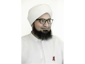 In this Saturday, Dec. 2, 2017 photo, Islamic scholar Sheik Ali al-Jifri, poses for a photograph after an event during World AIDS Day 2017 national advocacy campaign, in Cairo, Egypt. An alarming HIV epidemic is silently spreading in Egypt, with an annual growth of up to 40 percent and funds to deal with the crisis running out by next year, U.N. officials and activists say.