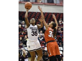 Mississippi State guard Victoria Vivians (35) shoots against Syracuse forward Miranda Drummond (32) during the second half of an NCAA college basketball game Thursday, Dec. 21, 2017, in Las Vegas. Mississippi State won 76-65.