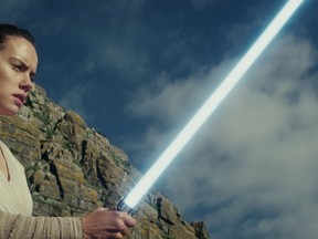 This image released by Lucasfilm shows Daisy Ridley as Rey in "Star Wars: The Last Jedi." "Star Wars: The Last Jedi" is off to a death star-sized start at the box office. Disney says Friday, Dec. 15, 2017,  that eighth installment in the space franchise has earned an estimated $45 million from Thursday night showings. (Lucasfilm via AP)