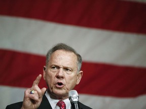 FILE - In this Dec. 5, 2017 photo, former Alabama Chief Justice and U.S. Senate candidate Roy Moore speaks at a campaign rally, in Fairhope Ala. Alabama voters pick between Republican Roy Moore and Democrat Doug Jones on Tuesday.