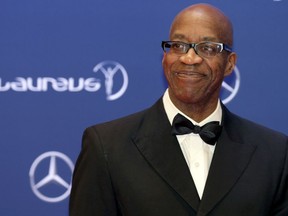 FILE - In this April 18, 2016, file photo, Edwin Moses poses for photos as he arrives for the Laureus World Sports Awards in Berlin, Germany. Three months after suffering the second of two traumatic head injuries in the span of six weeks, Edwin Moses is nearing 100 percent again. It's been an amazing recovery for one of America's best-known Olympic stars, and a man who is no stranger to making the impossible seem possible.